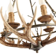 the antler chandelier is made out of wood and has four lights on each side