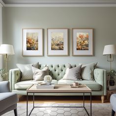 a living room filled with furniture and two pictures on the wall above it's coffee table