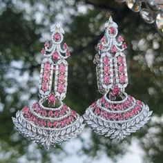 Silver Ruby diamond earrings are  Indian bollywood Desiner Style pair. Oversized Chandler earrings cute look high end pieces. Perfect for any stage or Evening party such like Wedding,  Stage shows,  Fashion modeling. Indian jewelry/Indian wear /pakistani jewelry/ Cz jewlery/ American Diamond Earrings/ Celebrity Earrings/Desi jewelry Silver Festive Earrings For Reception, Festive Silver Earrings For Reception, Silver Bollywood Danglers For Reception, Silver Chandbali Bridal Earrings For Reception, Bollywood Silver Danglers For Reception, Silver Chandelier Earrings For Reception And Festivals, Dazzling Party Chandelier Earrings Hand Set, Dazzling Hand-set Chandelier Earrings For Party, Silver Bollywood Chandelier Earrings For Reception