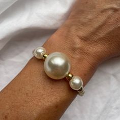 This pearl bracelet is the perfect gift idea for a birthday or mothers day gift. Bracelet is made with freshwater pearls, filled with 14k gold beaded style.A beautiful bracelet for the chic, timeless and stylish women to wear daily. Please avoid contact with perfume, soap, salty or chlorine water. The pearls can be cleaned with slightly wet soft piece of cloth. Pearls of different sizes in combination with gold-plated beads. - Handmade item - Materials: freshwater pearls, brass, 18k gold plated Gold Pearl Bracelet, Pearls Bracelet, Gift Bracelet, Bracelet Bead, Freshwater Pearl Bracelet, Bracelets For Women, Gold Pearl, The Chic, Bead Bracelet