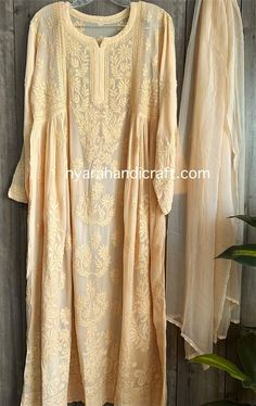 "Chikankari kurta on fine georgette with matching chiffon Dupatta. Matching liner included.  \"Embroidery designs may slightly vary\" Kurti Length-50 inches" Luxury Silver Dupatta With Chikankari Embroidery, Luxury Chikankari Embroidery Tunic For Festive Occasion, Luxury Jamawar Dupatta With Chikankari Embroidery, Luxury Chikankari Embroidered Dupatta For Spring, Luxury Summer Chikankari Embroidery Dupatta, Cream Georgette Kurta With Sheer Dupatta, Off White Georgette Kurta, Summer Georgette Kurta With Chikankari Embroidery, Beige Georgette Kurta With Resham Embroidery