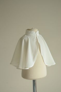 Our special elegant baptism cape! The cape is made of very light, softened chiffon fabric. With its delicate design and high-quality materials, it is sure to be a cherished keepsake for years to come. Our cloak is suitable both for girls and boys. Button closure at the front of the cape. If you're looking for a complete baptism package, we also offer a matching candle decoration that complements the cape perfectly.  ❤ Shop You can find all our capes here: https://www.etsy.com/shop/MatrinnaBoutique?ref=seller-platform-mcnav&section_id=28412759 You can find our entire shop here: https://www.etsy.com/shop/MatrinnaBoutique ❤ Size   See the size chart in the pictures! ❤ Material Chiffon 100% ❤ Color:  Cape: White ❤ SHIPPING *Please make sure your shipping address is up to date with your Etsy ac Elegant White Capelet With Cape Sleeves, Elegant White Cape With Cape Sleeves, Cape For Kids, White Cloak, Chiffon Cape, Cape Fashion, Candle Decoration, Lace Coat, Ruffle Outfit