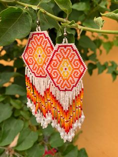 One of a kind shape bead earrings Colorful Beaded Dangle Chandelier Earrings, Colorful Beads Dangle Chandelier Earrings, Bohemian Dangle Earrings With Faceted Beads, Orange Beaded Dangle Jewelry, Dangle Chandelier Earrings With Colorful Beads, Artisan Orange Round Bead Earrings, Artisan Earrings With Dangling Round Beads, Faceted Beads Dangle Earrings For Festival, Festival Dangle Earrings With Faceted Beads