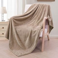 a chair with a blanket on top of it