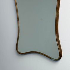 an old mirror hanging on the wall