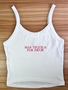 Stand out from the crowd and make a lasting impression with our Custom Embroidered Crop Top Tank. Perfect for team uniforms, bridal parties, bachelorette gifts, or retail merchandise! ✨Please note that my processing times are 2-3 weeks, and that does not include shipping time. Shipping time is an additional 3-5 business days, depending on the type of shipping you select at checkout. Please do not leave "need by" instructions in the notes, they will not be honored.✨ -52% cotton, 48% polyester. Th Fitted White Tank Top With Floral Embroidery, White Fitted Tank Top With Floral Embroidery, White Embroidered Cotton Tank Top, Fitted Summer Tops With Embroidered Graphics, Fitted Cotton Tank Top With Floral Embroidery, White Embroidered Cotton Crop Top, White Fitted Tops With Custom Embroidery, Fitted White Tops With Embroidered Text, White Tanks