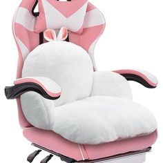 a pink and white chair with bunny ears on it