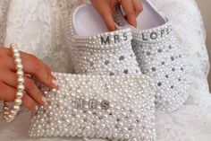 Welcome to our store :) -These handcrafted bridal slippers and matching clutch, adorned with white pearls and silver sparkling stones, make a stunning complementary pair for your special day. -Customization is FREE! We can personalize it any way you want. Please write the personalization you want in the ''Add your personalization'' section. If you do not want personalization, please leave it blank. -If you prefer a pearl color other than white, please review the pearl color options in the 10th p Bedazzled Things, Matching Slippers, Bridal Slippers, Wedding Bags, Bridal Bag, Bridal Clutch, Accessories Bags Purses, Wedding Preparation, Wedding Bag