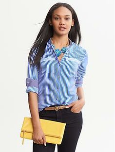 Vertical Stripe Blouse Blue Blouse With Pockets For Work, Chic Business Casual Tops With Pockets, Casual Office Blouse With Striped Collar, Chic Workwear Tops With Pockets, Chic Blouse With Collar And Pockets, Spring Blouse With Pockets And Fold Down Collar, Spring Workwear Blouse With Pockets, Chic Workwear Blouse With Roll-up Sleeves, Trendy Workwear Blouse With Pockets