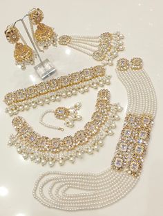 an assortment of pearls and gold jewelry