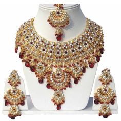 A DAZZLING AND AN EXQUISITE 4 PIECE NECKLACE- SET IN White,Dark red and Gold COLOR PERFECT FOR BRIDES AND FORMAL OCCASIONS Shipping through UPS courier and delivery time 8-10 working days depending on the destination Women Love Jewelry as it not only enhances their beauty, but also gives them the social confidence. This Piece of Jewelry will enhance your beauty and compliment your dress. Color: Golden and Ivory Gold Stone Material-Pearls ,Zirconand Kundan MetalGold Plated Tikka Jewelry, Perhiasan India, Zircon Necklace, Maang Tikka, Bollywood Wedding, Kundan Necklace, Bridesmaid Jewelry Sets, Set Jewelry, Kundan Necklaces