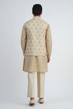 Beige dupion silk bundi jacket with floral hand embroidery. Comes with pant and a short kurta. - Aza Fashions Silk Nehru Jacket For Eid Reception, Silk Nehru Jacket For Reception During Eid, Silk Nehru Jacket With Zari Work For Reception, Festive Silk Nehru Jacket For Reception, Traditional Silk Nehru Jacket For Reception, Fitted Silk Nehru Jacket For Reception, Silk Fitted Nehru Jacket For Reception, Fitted Silk Nehru Jacket With Chikankari Embroidery, Transitional Nehru Jacket With Pallu For Reception