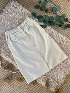 "Beautiful Givenchy Sport Skirt  In winter white with pockets and high waist fit Fabric is thick and luxurious and in excellent condition- no issues whatsoever Micropleating below waistband Buttons all the way down the front Pockets on both sides Tag says \"10\" for size but it has been professionally tailored and fits more like a modern 4/6 Measurements: Waist: 13.5\" laying flat Length: 25\" from waistband to bottom hem If you have any questions about this item please feel welcome to ask" Skirt In Winter, Sport Skirt, Vintage Givenchy, Sports Skirts, Skirt With Pockets, Skirts With Pockets, Winter White, Givenchy, Button Downs