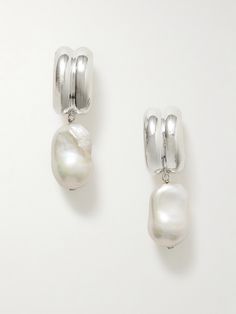 Modern art serves as a main inspiration for AGMES, resulting in sculptural jewelry like these 'Juliette' earrings. Handmade from recycled silver, they have a chunky hoop silhouette anchored by baroque pearl drops. Elegant Hand-cast Jewelry, Sterling Silver Clip-on Drop Pearl Earrings, Sterling Silver Clip-on Pearl Drop Earrings, Modern Silver Pierced Pearl Earrings, Luxury Silver Single Pearl Earring, Modern Hand Cast Sterling Silver Earrings, Elegant Hand Cast Metal Earrings, Silver Sterling Pearl Drop Clip-on Earrings, Silver Sterling Silver Pearl Drop Clip-on Earrings