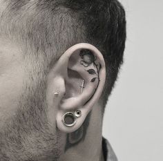 a man with ear piercings on his ears