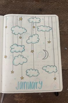 an open notebook with clouds and stars on it