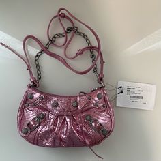 Brand New Bag In Excellent Condition. This Bag Comes In A Metallic Pink Color With Strass Studs Accents. Bag Comes With Dust Bag. Also A Strap So It Can Be Worn As A Shoulder Bag Designer Clutch Shoulder Bag With Silver-tone Hardware, Clutch Shoulder Bag With Silver-tone Hardware, Designer Pouch Shoulder Bag, Designer Crossbody Evening Bag For Shopping, Designer Evening Bag With Adjustable Strap, Fashion Accessory Shoulder Bag With Silver-tone Hardware, Designer Bag With Chain Strap, Shoulder Bag With Silver-tone Hardware For Fashion Accessory, Silver-tone Hardware Shoulder Bag