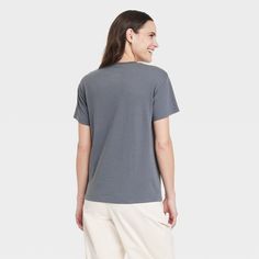 Upgrade your casual wardrobe with the lightweight Women's NYC Short Sleeve Graphic T-Shirt in Gray. Blended with polyester and cotton to provide a soft, breathable feel, allowing you to stay flexible and relaxed all day. The regular fit is meant for a classic look with a pullover design for effortless styling. The lightweight fabric ensures a comfy feel and is easy to layer in warmer weather. Easy to care for, simply toss it in a washing machine and tumble dry to make laundry day a breeze. Casual Gray T-shirt For Loungewear, Comfortable Gray Crew Neck T-shirt, Comfortable Gray Cotton Top, Casual Gray Tops With Comfortable Fit, Comfortable Fit Cotton Short Sleeve Tops, Comfortable Cotton Short Sleeve Tops, Casual Shirt With Comfortable Fit And Crew Neck, Comfortable Fit Cotton Top With Short Sleeves, Comfortable Cotton Top With Short Sleeves