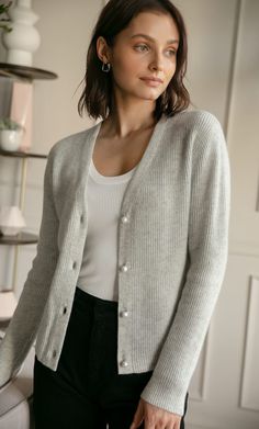 A timeless, versatile classic that layers beautifully with just about any outfit for an effortlessly chic look. Knit with supremely warm and lightweight cashmere, you won't want to leave home without it. V-neck cardigan with elegant ribbed knit. White pearlescent buttons. Hits at the hips. Wear open or buttoned up. FIT: Relaxed fit. Size down if you're between sizes. 100% LUXURY CASHMERE Everyday Luxury, Cashmere Wrap, Cashmere Turtleneck, Wrap Cardigan, V Neck Cardigan, Cashmere Coat, Cashmere Cardigan, Cashmere Scarf, Cute Woman