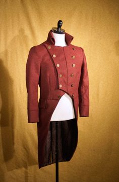 "ABOUT THIS STYLE: Cut in a double-breasted military style for a plastron effect with a center front seam that allows you to wear the lapels partially unbuttoned and a stand-up back collar. The fabric is an English woven herringbone tweed that is both luxurious and rustic. CUSTOM FROCKS AND TAILS: All of our morning coats and tailcoats are custom----So just let us know what you might like and we can design something for you. Any fabric, silhouette, or trim is possible. For about $100 we can also Semi-formal Fitted Double-breasted Wool Coat, Fitted Double-breasted Outerwear With Buttons, Fitted Double-breasted Tweed Jacket For Fall, Fitted Stand Collar Pea Coat For Business, Fitted Pea Coat With Stand Collar For Business, Semi-formal Double-breasted Outerwear With Buttons, Formal Single Breasted Pea Coat With Stand Collar, Fitted Stand Collar Blazer With Buttons, Double-breasted Tweed Blazer