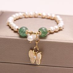 Pearl Crystal Bracelet With Pearl Charm As Gift, White Butterfly Bracelet For Gift, Pearl Jewelry With Butterfly Charm For Gift, Pearl Jewelry With Butterfly Charm As Gift, White Butterfly Charm Bracelet For Gift, Butterfly Charm Jewelry With Round Beads As Gift, Elegant Jewelry With Butterfly Charm And Round Beads, Pearl Jewelry With Butterfly Charm, Pearl Butterfly Charm Jewelry