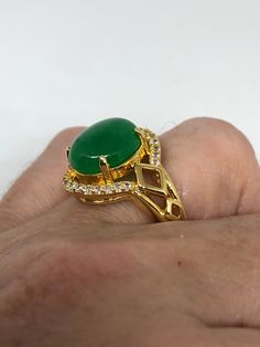 Vintage Lucky Green Nephrite Jade Golden ring Large green nephrite jade Gold finished German Silver Vintage ring, does not tarnish, NOT sterling Size 7, 8, or 9 All rings are shipped free in the US in a nice gift box. Check out our over a THOUSAND great reviews Engraving is $4 per letter and is not always perfect depending on the piece. It can take a few days if the jeweler is busy. This is payable to Paypal Judithsltd@gmail.com Green Crystal Gemstone Ring For Spiritual Wear, Green Onyx Oval Ring, Oval Green Onyx Rings, Green Jade Spiritual Rings, Spiritual Green Jade Rings, Green Emerald Spiritual Ring, Spiritual Jade Gemstone Rings, Green Emerald Spiritual Ring For Anniversary, Green Chrysoprase Gemstone Rings