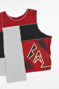 Arizona Diamondbacks Scrappy Tank Top Reworked from a Majestic Shirt Size 2XL THIS ITEM IS ONE OF A KIND 🔥 ONLY ONE AVAILABLE! Click here to see our size chart Want a similar top made in a different size? Click here to place a custom order. Please read our FAQ and Return/Exchange policies before placing an order. ------------------- ☆Tonguetied Apparel creates unique, one-of-a-kind upcycled garments from vintage/thrifted apparel. These thrifted/vintage garments may have some minor damages inclu Stretch Patchwork Tops For Layering, Red Cotton Patchwork Top, Red Cotton Tops For Layering, Casual Sleeveless Patchwork Top, Reworked Cotton Crew Neck Tops, Cotton Crew Neck Reworked Tops, Casual Crew Neck Upcycled Top, Reworked Fitted Casual Tops, Black Sleeveless Top With Patchwork