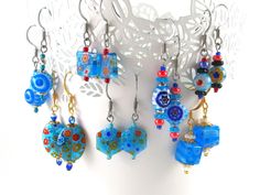 A handmade pair of millefiori earrings, made to order to your specifications!  This listing features a pair of matched millefiori glass floral beads in your choice of pattern, with glass and plated steel accents, on your choice of hypoallergenic steel, gold plated steel, or sterling silver (stamped .925).  I adore millefiori glass (if it's not obvious from the rest of the site), and use it frequently when designing jewelry. These earrings are simple in design but have a ton of character that I think will appeal to anyone. They're cute, trendy, and eye-catching, while also being lightweight and fun to wear.  Millefiori glass also has a lot of variation from piece to piece, with some flowers being larger or smaller, or having an angle embedded in the glass.  No worries!  I will always choose Designing Jewelry, Stained Glass Earrings, Stained Glass Jewelry, Turquoise Glass, Geometric Jewelry, Delicate Earrings, Simple Earrings, Fun Earrings, Glass Earrings