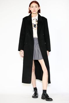 Indulge in timeless elegance with our Double-Sided Wool Black Wrap Coat. This heavyweight classic exudes sophistication and comes complete with a belt for versatile styling. The double-breasted design adds an extra layer of refinement, while the two pockets provide both style and convenience. What sets this coat apart is its full lining, ensuring comfort and warmth in every wear. Wrap yourself in luxurious fashion that effortlessly combines style and practicality. Elevate your winter wardrobe with this standout piece that promises both cozy comfort and chic allure. Composition: 100% Wool Heavyweight fabric Designed for a relaxed fit, fits true to size Made in New York SNOWXUEGAO.COM Elegant Winter Outerwear With Belt Loops, Elegant Fitted Outerwear With Belt Loops, Elegant Belted Outerwear For Formal Occasions, Timeless Black Formal Outerwear, Timeless Black Semi-formal Outerwear, Black Double-breasted Outerwear For Formal Events, Elegant Long Coat With Belt Loops, Classic Black Outerwear With Belt Loops, Black Business Outerwear With Belt Loops