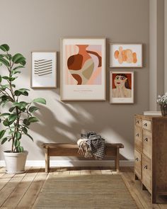 a living room filled with furniture and pictures on the wall next to a potted plant