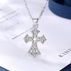 Feel blessed and stay classy by wearing this religious cross designed neck jewelry. Innovato Designs introduces another top-of-the-line religious accessory that is amazingly detailed and intricate.  Wearing the luxury fashion Celtic cross necklace is a testament of your faith and shows your angelic beauty that brightens the room.  The necklace pendant is made of pure 925 sterling silver and polished into perfection. The 18k Rhodium plates make the jewelry shine brightly just like real platinum. It is highly resistant to oxidation, color-change, as it is also very safe and fashionable.  Specifications:   Trendy Celtics pendant necklace for women  Link chain necklace  The cross-patterned pendant at 28 x 17mm big  Made of 100% 925 Sterling silver  Gift for girlfriend, fiancée, wife, lover Angelic Beauty, Celtic Cross Necklace, Wood Inlay Rings, Catholic Cross, Couples Wedding Bands, Neck Jewelry, Punk Accessories, Masonic Ring, Religious Cross