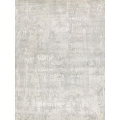 an area rug with grey and white colors