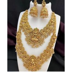 Description: Enhance your elegance with this stunning Traditional Indian Kundan Necklace Set featuring matching earrings, meticulously crafted to perfection. This exquisite jewelry set is the epitome of luxury, blending traditional design with contemporary flair, making it a must-have for every jewelry collection. Product Features: Material: High-quality Kundan stones, gold-plated alloy, and pearl detailing. Design: Intricately designed with a beautiful combination of green and pink beads that add a pop of color, perfect for any occasion. Earrings: Matching earrings with a comfortable fit, complementing the necklace perfectly. Necklace Length: Adjustable with a drawstring closure to suit your neckline and preference. Occasion: Ideal for weddings, bridal wear, engagements, festive occasions Elegant Bridal Sets With Latkans For Festive Occasions, Elegant Sets With Latkans For Gifts, Elegant Gift Sets With Latkans, Elegant Dual-tone Chandbali Jewelry Sets, Gold Dual-tone Jewelry For Wedding, Elegant Dual-tone Jewelry Set For Diwali, Gold Dual-tone Wedding Jewelry, Dual-tone Gold Wedding Jewelry, Elegant Bridal Sets With Latkans For Festivals