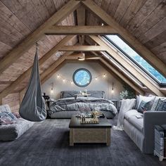 an attic bedroom is decorated in wood and gray