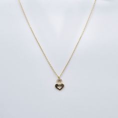 Experience the enchanting allure of our Pave Gemstones Lock Heart Pendant Necklace. Crafted in 10K solid gold, this captivating piece features a heart-shaped pendant adorned with dazzling pave gemstones, adding a touch of glamour and sophistication to any outfit. Necklace Length: 16"Pendant Size: 9 x 12 mm Elegant Double Heart Cubic Zirconia Necklace, Elegant Cubic Zirconia Heart Charm Necklace, Elegant Cubic Zirconia Heart Necklace, 14k Gold Heart Charm Necklace, 14k Gold Heart Necklace With Gemstone, Cubic Zirconia Heart Necklace With Gemstone, 14k Gold Gemstone Heart Necklace For Valentine's Day, 14k Gold Gemstone Heart Necklace For Anniversary, Elegant Heart Necklace With Birthstone And Cubic Zirconia