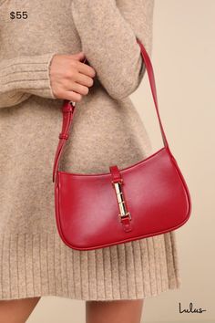 The Lulus Chic and Tasteful Red Shoulder Bag was made to be the sleek finish to all your favorite 'fits! Smooth faux leather shapes this must-have handbag that boasts a rectangular silhouette with a flat bottom design and a wide adjustable shoulder strap with a gold buckle detail. Undo the shiny gold magnetic closure at the front to reveal a lined interior with plenty of room for all your daily necessities. Zip top for extra secure closure. Lined. Bag Measures 9. 5" Wide, 5. 5" Tall, And 2. 5" Deep. Adjustable 22" Shoulder Strap Has A Drop Between 9" And 11. 5". Self: 100% PU. Lining: 100% Recycled Pet Fabric. Hand Wash Cold. Do Not Bleach. Hang To Dry. Imported. Lulus | Chic and Tasteful Red Shoulder Bag. Trendy Red Leather Baguette Bag, Chic Red Baguette Bag For Formal Occasions, Chic Red Baguette Bag For Formal Events, Rectangular Baguette Bag For Shopping With Gold-tone Hardware, Sleek Rectangular Bags With Gold-tone Hardware, Sleek Rectangular Bag With Gold-tone Hardware, Chic Red Leather Baguette Bag, Red Leather Rectangular Baguette Bag, Red Square Box Bag For Office