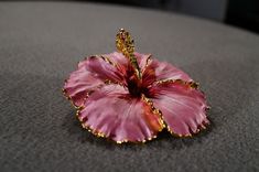 I am offering this fabulous vintage yellow gold tone pin. This piece is truly gorgeous, and it has the following features: * beautiful vintage brooch * enameled * floral design * pink * 2 inches in length This is a fantastic and classic piece. There is tons of sparkle and shine with this piece. It will beautifully complement your upcoming fashion season. Buyer pays all shipping and handling. Elegant Pink Enamel Brooch Pin, Elegant Pink Enamel Pin, Pink Flower Enamel Brooch, Unique Pink Brooches As A Gift, Unique Pink Brooches As Gift, Unique Pink Brooches For Gifts, Collectible Gold Flower Enamel Pin, Vintage Pink Enamel Pin Gift, Elegant Pink Enamel Pin For Gift