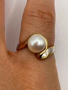 Vintage white cultured pearl  Sterling silver with gold setting   Re sizing has a $20 jeweler's fee. All rings are shipped in a nice gift box.   Check out our over a THOUSAND great reviews Engraving is $4 per letter and is not always perfect depending on the piece. It can take a few days if the jeweler is busy. This is payable to Paypal Judithsltd@gmail.com Gold Pearl Ring With Polished Finish For Anniversary, Gold Pearl Ring Stamped 14k For Gift, Elegant White Pearl Ring Gift, Sterling Silver Yellow Gold Pearl Ring For Anniversary, Yellow Gold Sterling Silver Pearl Ring For Anniversary, Anniversary Sterling Silver Pearl Ring In Yellow Gold, White Pearl Ring With Polished Finish For Anniversary, Formal White Rings With High Luster, White Pearl Drop Ring For Anniversary