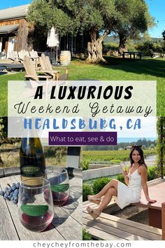 a woman sitting on a picnic table with wine