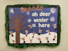 a bulletin board with reindeers and a tree on it that says, oh deer winter is here