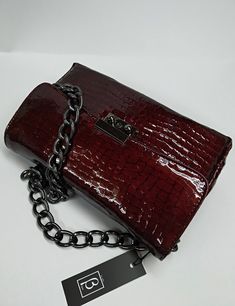 An elegant classic style bag with a strong scent of the legendary original designs that marked deeply the modern fashion, made of high quality genuine greek calf leather, processed properly in order to resemble croc leather. The bag's inner space is seperated in three (3) divisions, as also a zipped pocket is included. The chain is made of black nickel and it's proper for the use of the bag as a Shoulder Bag. The bag includes a safety lock, which can be opened simply via sliding the small round Elegant Faux Leather Bags For Formal Occasions, Elegant Formal Faux Leather Bags, Elegant Rectangular Faux Leather Bag, Elegant Bags With Removable Pouch In Faux Leather, Elegant Rectangular Shoulder Bag With Textured Leather, Elegant Faux Leather Bag With Removable Pouch, Elegant Rectangular Shoulder Bag In Textured Leather, Elegant Rectangular Faux Leather Box Bag, Elegant Textured Leather Rectangular Bags