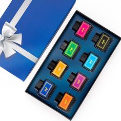 a blue box with six different colored candies in it