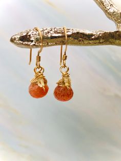 "Dainty sparkling sunstone brios (approx 12mm x 8mm) are raindrop cut and faceted with outstanding color and sparkle. Paired with Citrine rounds. This pair measures 1 1/8\" inches long including the ear wires. They are wrapped in 14k gold fill and hang from gold fill ear wires. The coordinating hair pin (pictured in last photo) is available in our store here: https://www.etsy.com/shop/BlueHeronJewelry?ref=seller-platform-mcnav&section_id=28051102 Blue Heron Jewelry and Hair Accessories have Gemstone Hair, Sunstone Earrings, Herkimer Diamond Earrings, Sunstone Jewelry, Oregon Sunstone, Gold Hair Pin, Citrine Earrings, Garnet Earrings, Luxury Hair