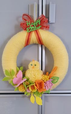 a yellow wreath with a chicken on it