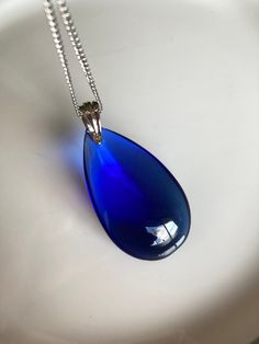 Blue Teardrop Pendant Necklace In Sterling Silver, Blue Sterling Silver Teardrop Pendant Necklace, Blue Teardrop Drop Necklace For Formal Occasions, Formal Blue Teardrop Drop Necklace, Blue Briolette Drop Necklace, Blue Drop Necklace For Gift, Blue Drop Necklaces For Gifts, Formal Blue Drop Necklace, Nickel-free Blue Teardrop Pendant Jewelry