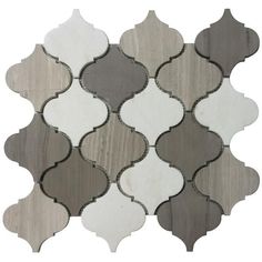 a white and grey tile with an intricate design