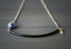 Curved bar necklace black tube necklace short necklace asymmetric necklace gold blue bead modern lea Gold Geometric Necklace, Curved Bar Necklace, Unusual Necklace, Tube Necklace, Black Tube, Bar Jewelry, Curved Bar, Necklace Organizer, Mismatched Earrings