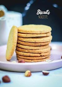 a stack of cookies sitting on top of a white plate