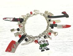 Thank God it's Friday! This charm bracelet brings to mind that Friday night horror movie and  slasher film. This movie proves camp grounds are not the safest place to be! Great gift for fans of horror movies, scary movies and most of all Halloween! This charm bracelet is fully loaded and Includes the following  15 charms mixed with red and black crystal glass beads: number 13 hunting knife  camp ground sign axe cabin bloody cleaver swimmer hockey mask slasher canoe flashlight  bloody knife cleaver bloody axe  fire tombstone  ❤️ Perfect for Gift Giving ❤️ All charm bracelets come in an organza bag that sits inside a gift box. So this is perfect for gift giving 🎁 You will also receive a FREE small jewelry polishing cloth, a FREE jewelry care instructions on a business sized card and a FREE Novelty Silver Halloween Bracelet, Novelty Silver Bracelet For Halloween, Silver Halloween Novelty Bracelet, Halloween Themed Silver Bracelet, Silver Themed Bracelet For Halloween, Movies Scary, Movie Jewelry, Halloween Charm Bracelet, Camp Ground