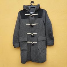 "JW Anderson X Uniqlo Wool Duffle Jacket with Hoodies Size on tag : S (please refer to actual measurement given and compared with your best fitting clothes ) Measurement: (garment laid flat) Width (Armpit to armpit): 19.5\" inches Length (Top shoulder to bottom): 34\" inches Length (shoulder to shoulder): 16\" inches Length (sleeves): 23\" inches Tag : J.W Anderson x Uniqlo Made in : China Material :Polyester/Wool Condition :Used" Hooded Wool Winter Outerwear, Casual Hooded Pea Coat With Pockets, Winter Workwear Hooded Jacket With Double-lined Hood, Gray Fitted Outerwear With Drawstring Hood, Winter Outerwear With Toggle Closure For Cold Weather, Hooded Winter Parka For Workwear, Hooded Winter Workwear Parka, Winter Workwear Parka With Hood, Casual Wool Hooded Jacket With Long Sleeves